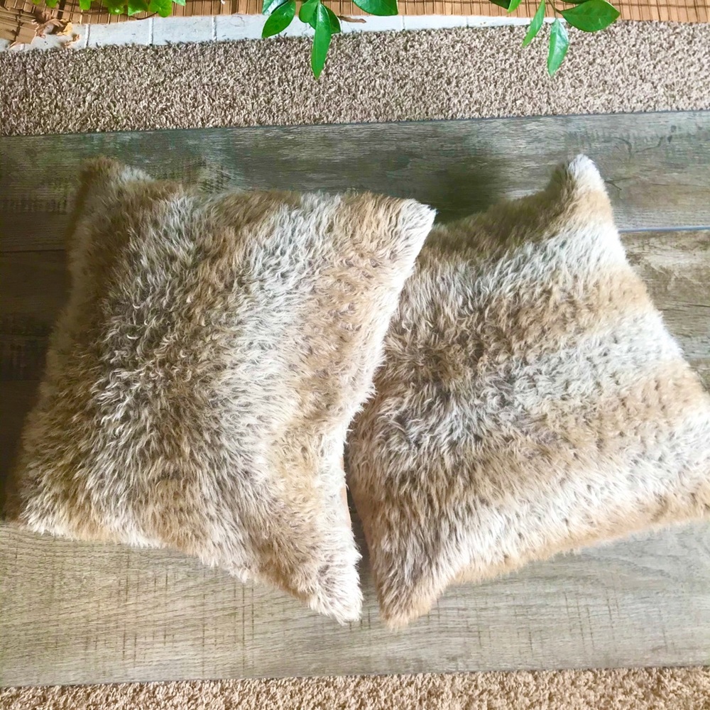 A Pair of Large Faux Wolf Fur Pillows